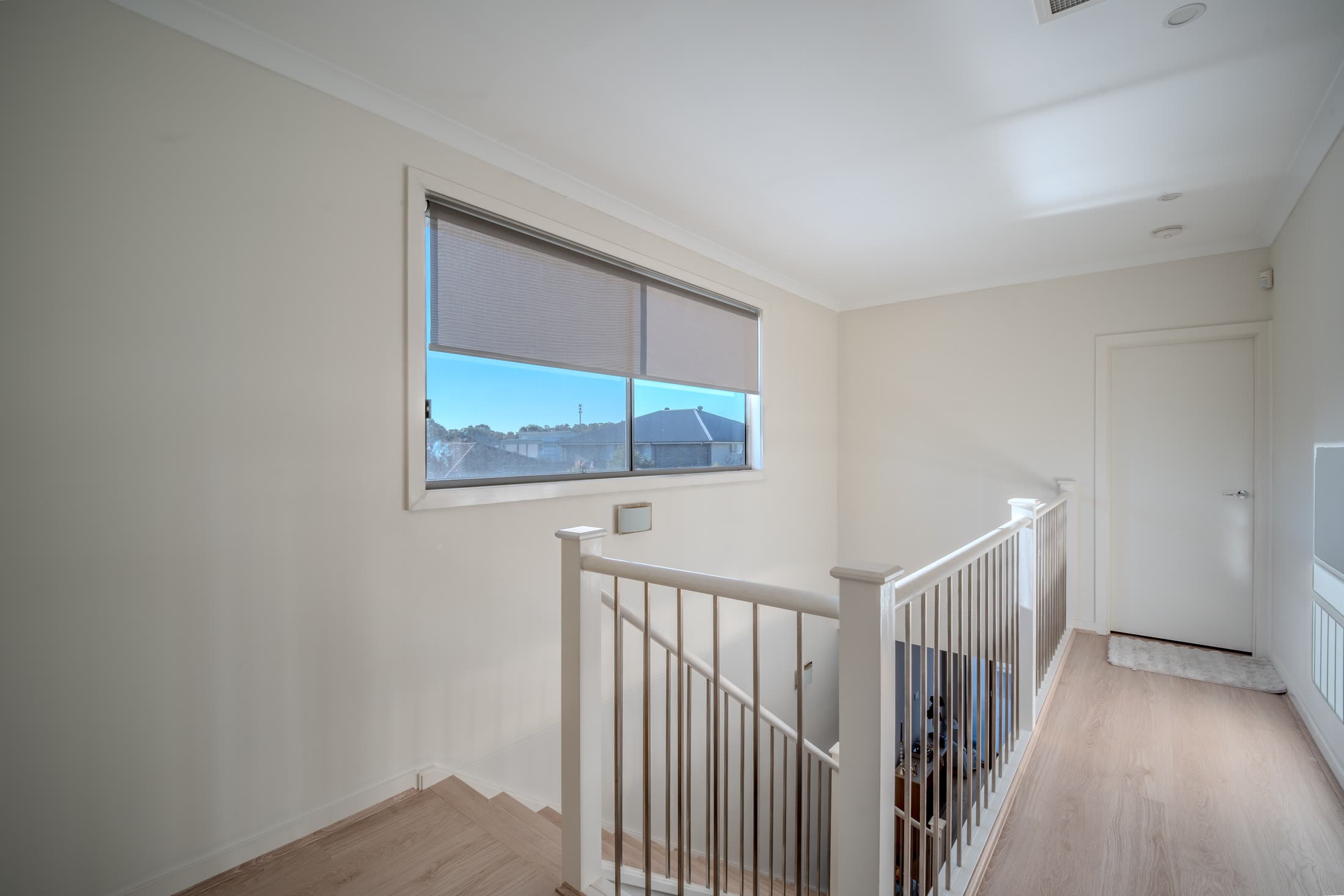 Blinds fitted to a stairwell window